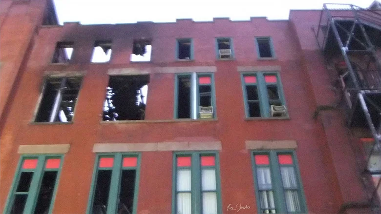 Brick Building with Red and Green Windows screenshot 1
